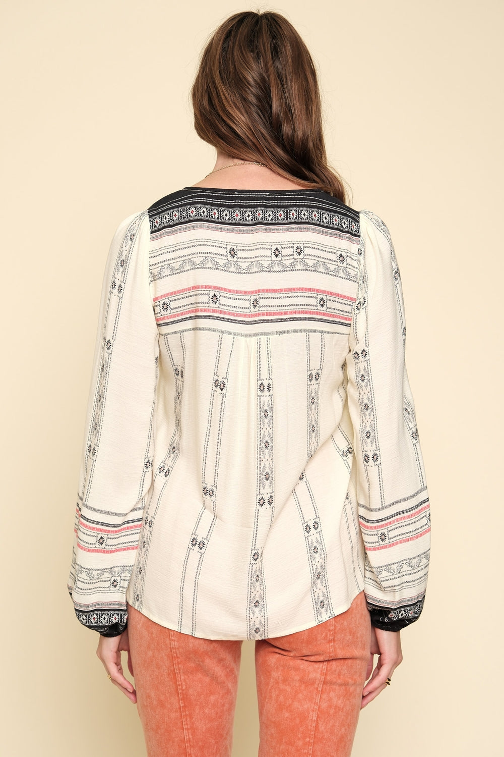 Boho Border Print Top: Trendy top with balloon sleeves, tassel tie V-neck, and contrasting shoulder and cuff details. Versatile and stylish with intricate border print. Perfect for pairing with jeans or skirts for effortless boho-chic fashion.