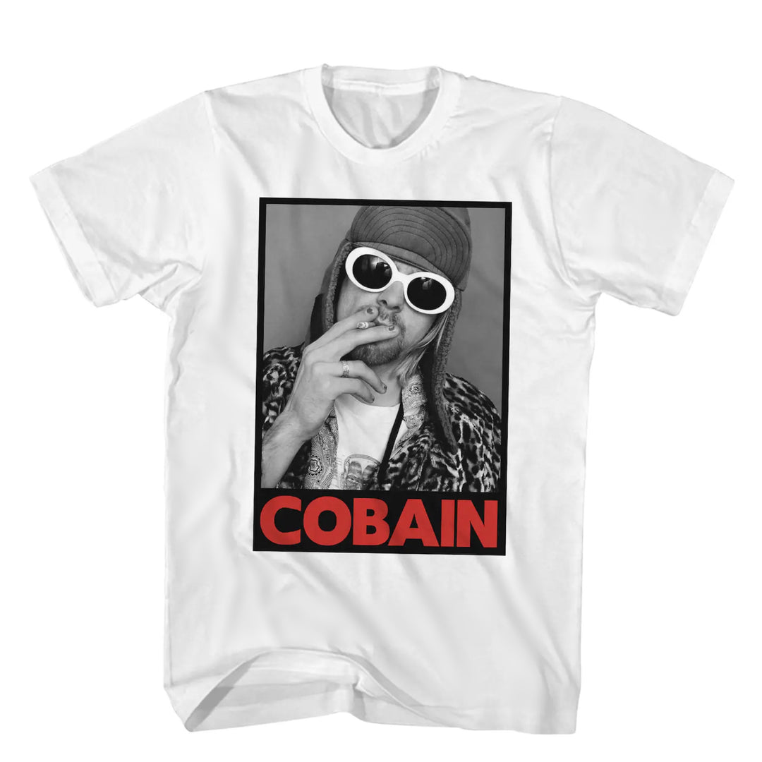 White graphic t-shirt showcasing Kurt Cobain's iconic photo with his last name in red text underneath.