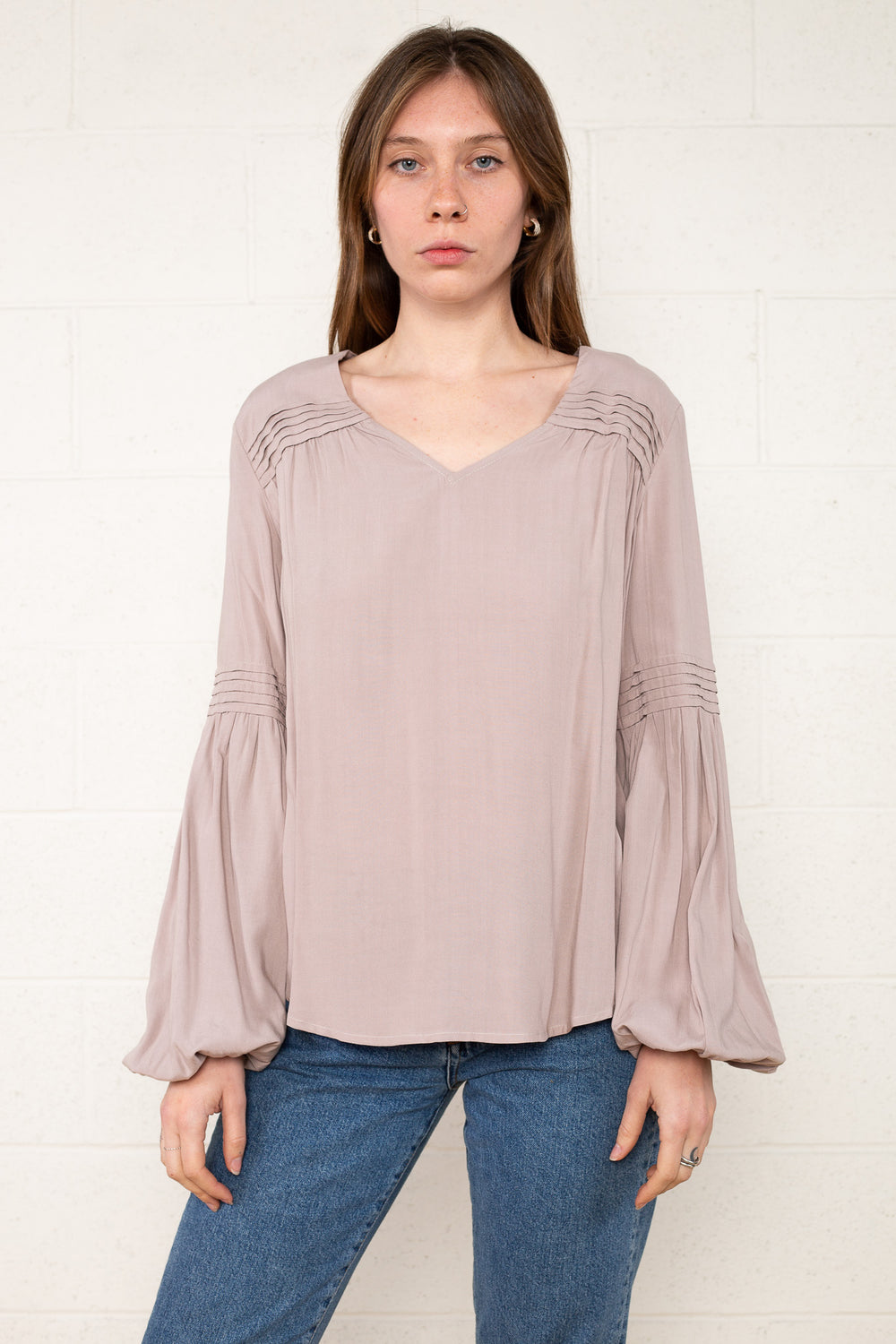 Ariella Pintuck Flare Sleeve Top by NLT: Chic long sleeve blouse with intricate pin-tucking and trendy flare sleeves. Versatile style for day-to-night transitions, blending sophistication and comfort seamlessly.
