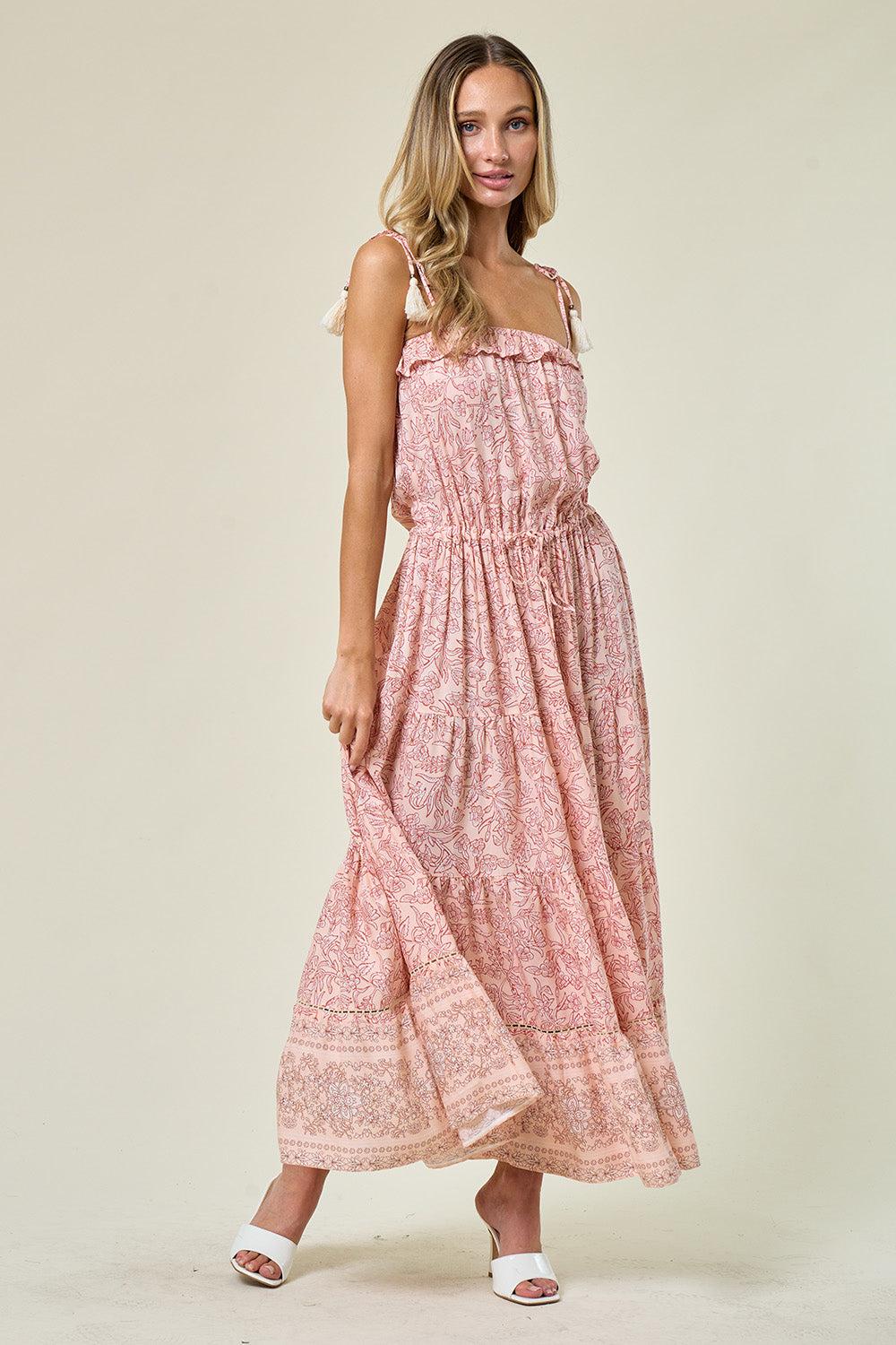 Boho Paisley Print Maxi Dress: Maxi dress with elastic waist and tassel ties, adjustable tassel straps, tiered skirt with crochet inset detail, pull-on style, and ruffle bodice. Embrace boho-chic fashion for a stylish and comfortable look.