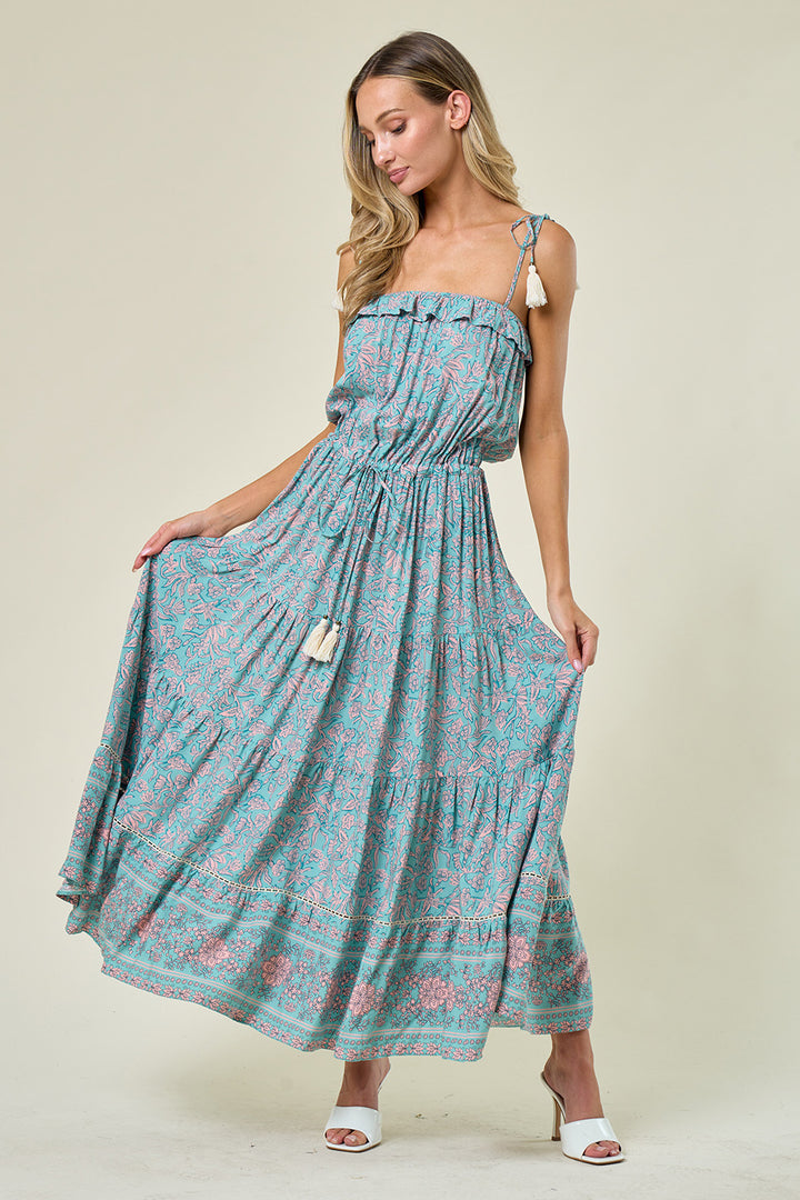 Boho Paisley Print Maxi Dress: Maxi dress with elastic waist and tassel ties, adjustable tassel straps, tiered skirt with crochet inset detail, pull-on style, and ruffle bodice. Boho-chic fashion for a stylish and comfortable look.