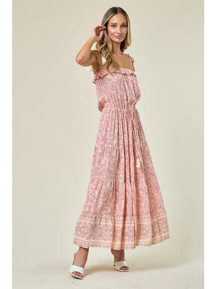 Boho Paisley Print Maxi Dress: Maxi dress with elastic waist and tassel ties, adjustable tassel straps, tiered skirt with crochet inset detail, pull-on style, and ruffle bodice. Embrace boho-chic fashion for a stylish and comfortable look.