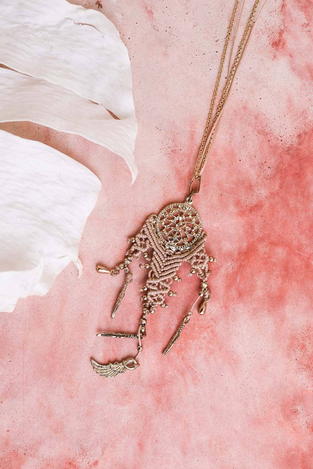 Boho Dream Weave Necklace: Dangling charms, intricate pendant weaving. Elevate your style with this mystique dreamcatcher. Shop now for timeless bohemian charm.