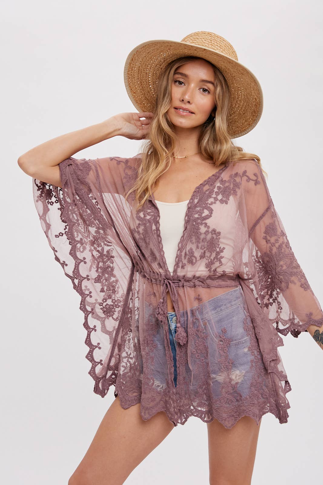 Short Embroidered Kimono: Open-front design, 3/4 wide bell sleeves, scalloped hemline, and waist tie string with tassel. Versatile and stylish for layering, pairing with a maxi dress, or as a beach cover-up. Elevate your style with this chic and comfortable kimono.